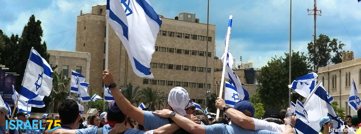 Hands around shoulders, flags waving - together as one