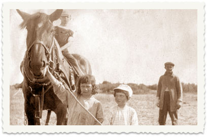 Children with a horse in Asher's field (Asher standing in the background)