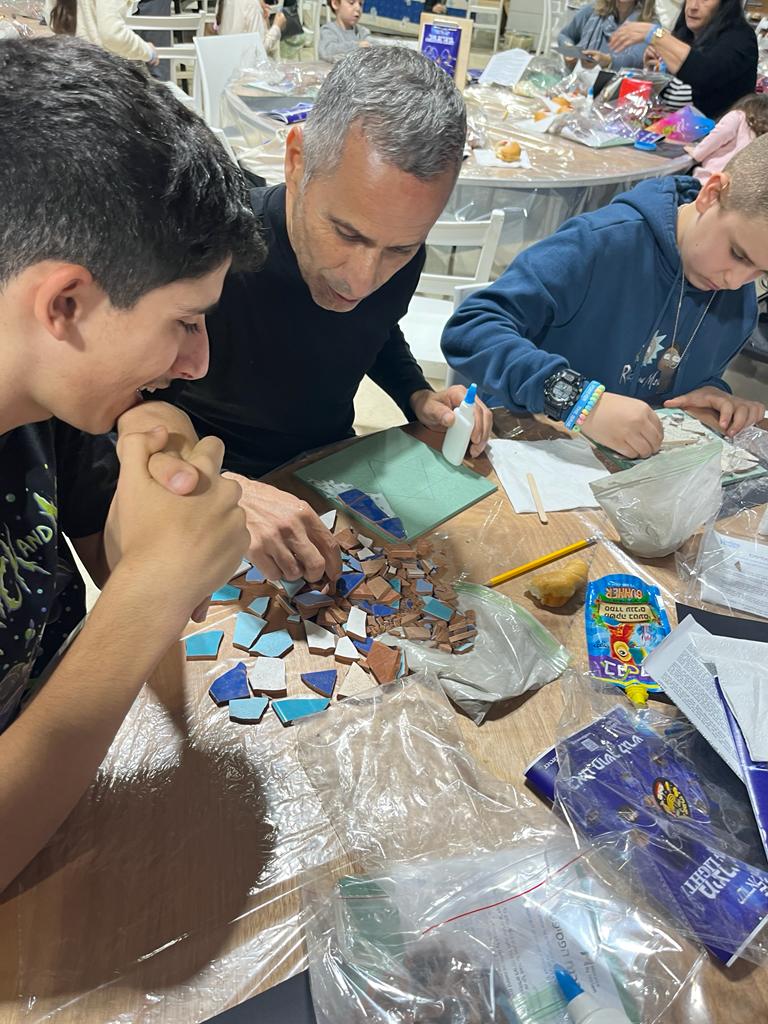 Sderot family working on mosaic
